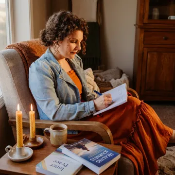 Woman journaling during a calming trauma support session