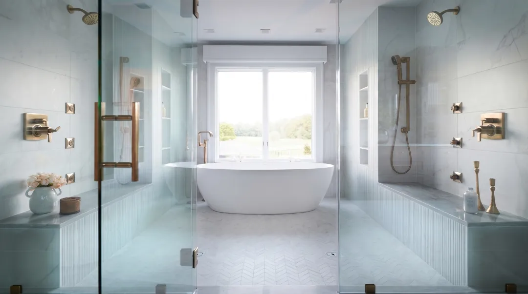 Luxury wet room with continuous zellige tile shower and freestanding soaking tub