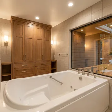 Luxury bathroom with walk-in bathtub in Encino home