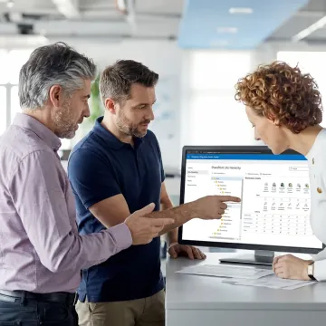 Team reviewing Microsoft 365 migration strategy