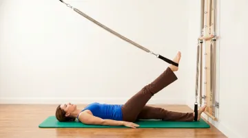 Pilates Tower apparatus spring resistance exercise low-impact rehabilitation session