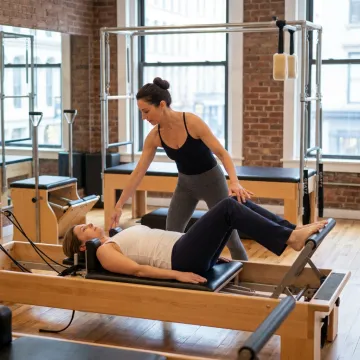 Pilates instructor guiding a rehabilitation session