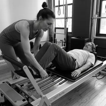 Pilates instructor guiding a gentle recovery session