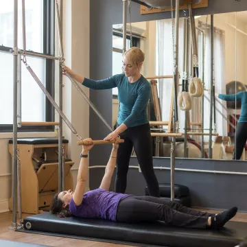 Pilates tower training in a boutique studio