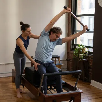 Pilates instructor coaching athletic movement