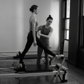 Dance-focused Pilates session on studio equipment