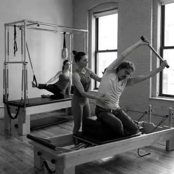 Clinical Pilates therapy session in a classical NYC studio