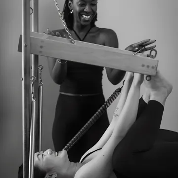 Pilates instructor coaching athletic movement