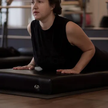 Private Pilates rehabilitation session in a boutique studio