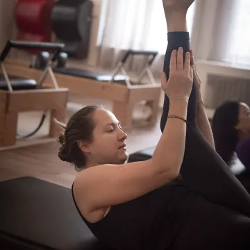 Floor Pilates class in a calm boutique studio