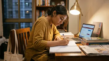 Indian student analysing demonetisation economic impact with books and news articles