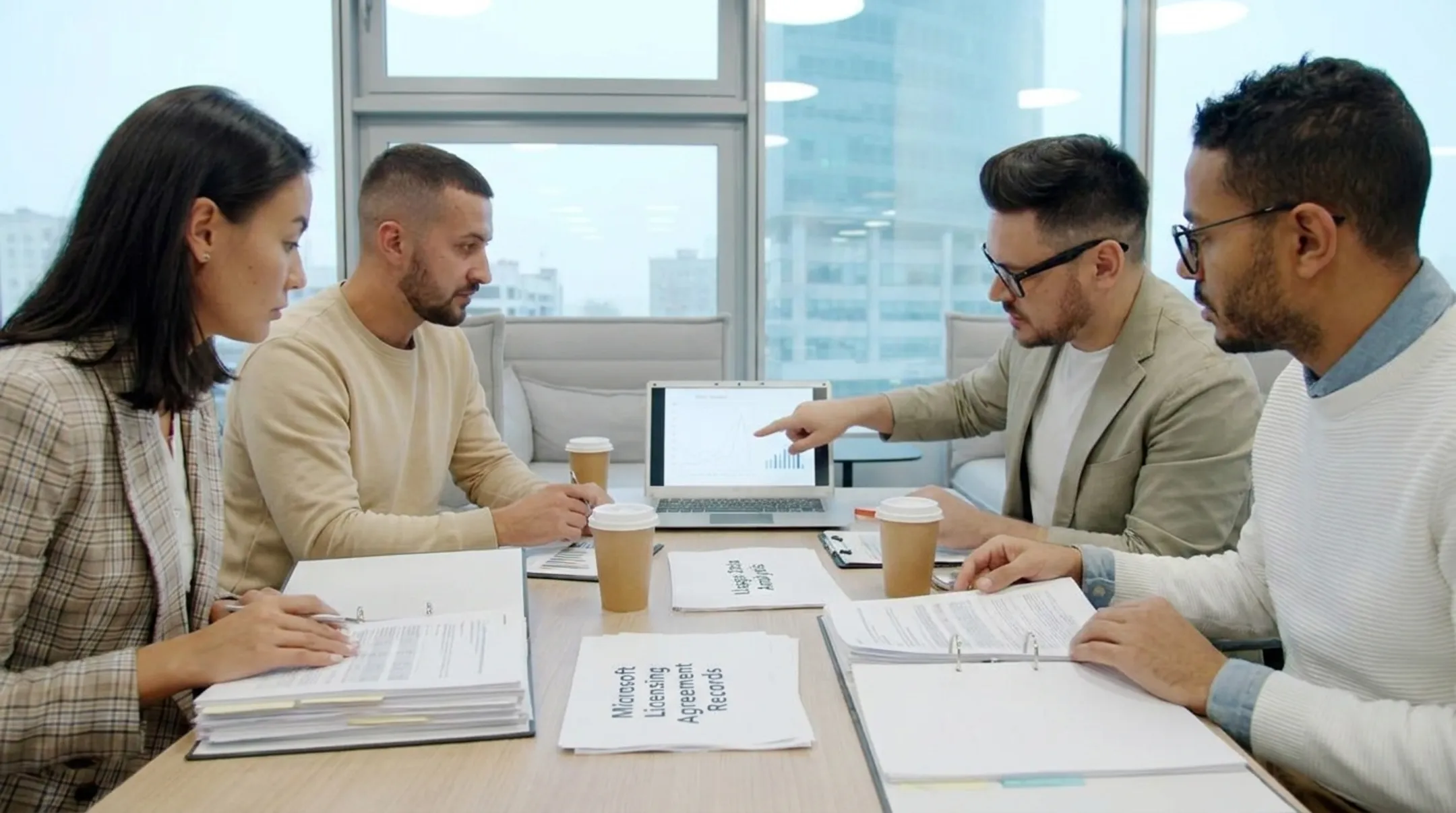 Microsoft licensing advisors reviewing enterprise agreement usage and costs