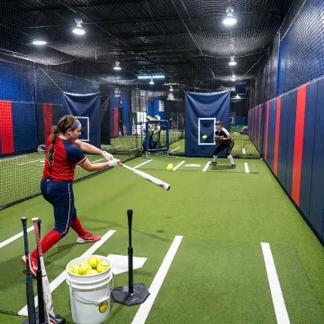 Indoor softball batting cage training facility