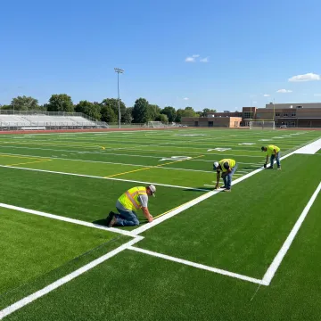 Artificial turf school athletic field installation