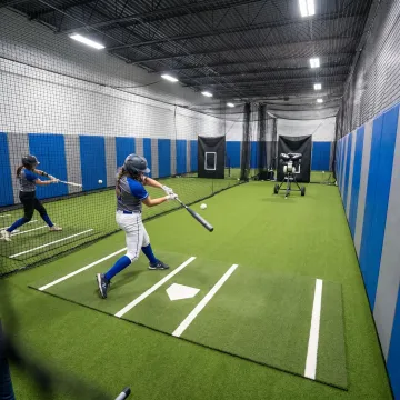 Indoor softball batting cage training facility