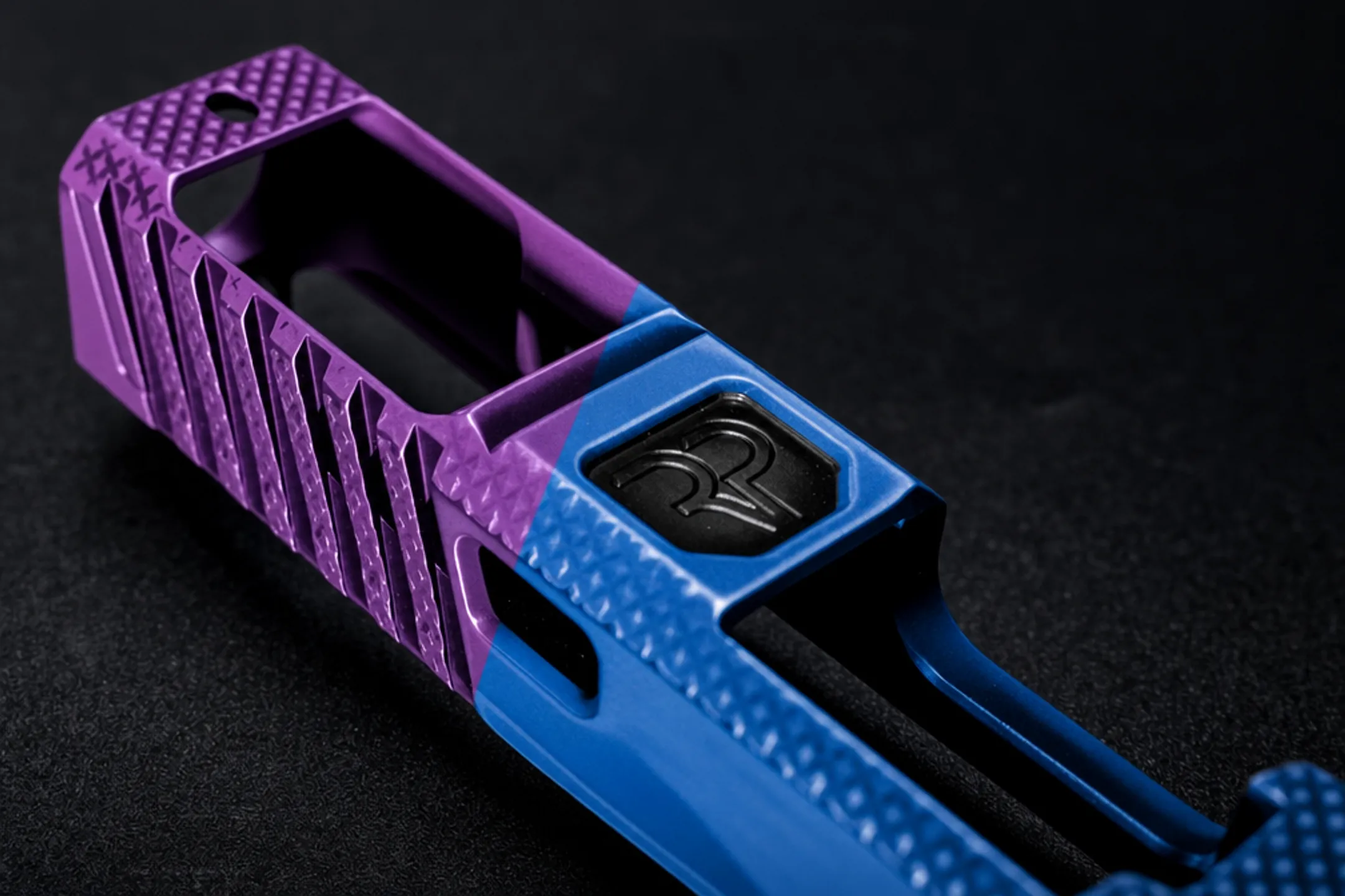 Cerakote finished firearm slide showing custom color pattern and sheen
