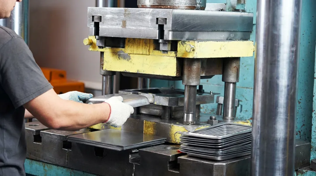 Industrial punch press tooling setup in high-volume metal stamping manufacturing facility