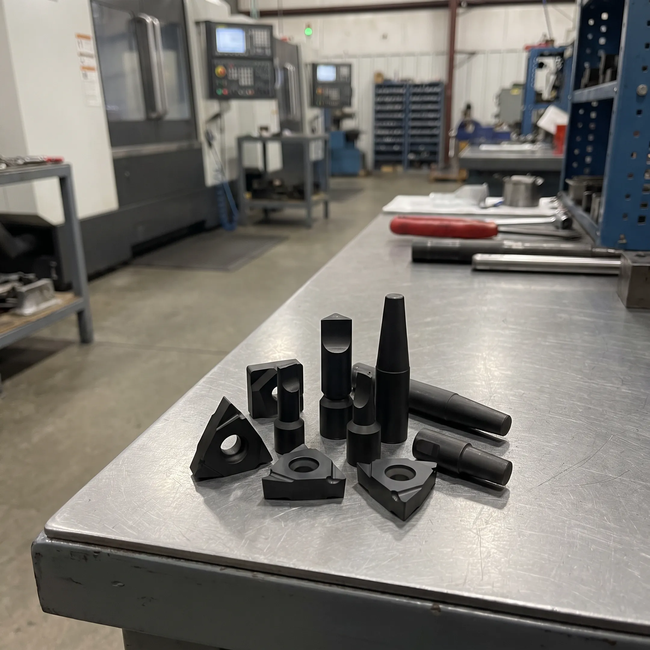 Coated die cast tooling in a manufacturing facility