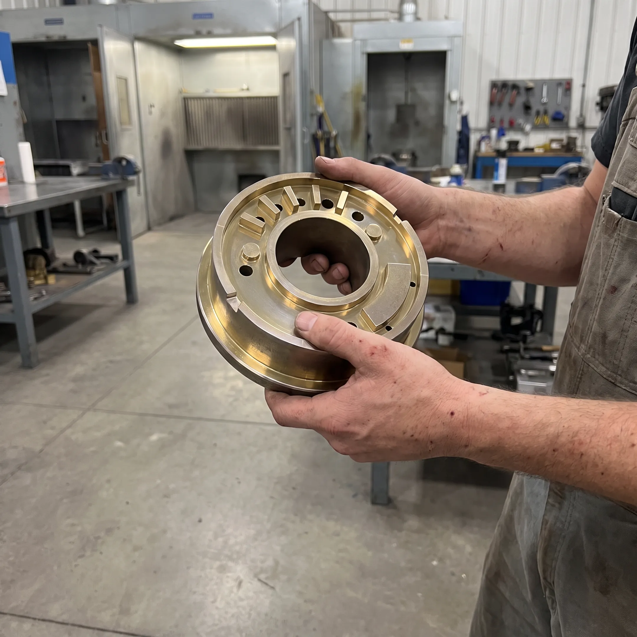 Technician inspecting coated steel tooling