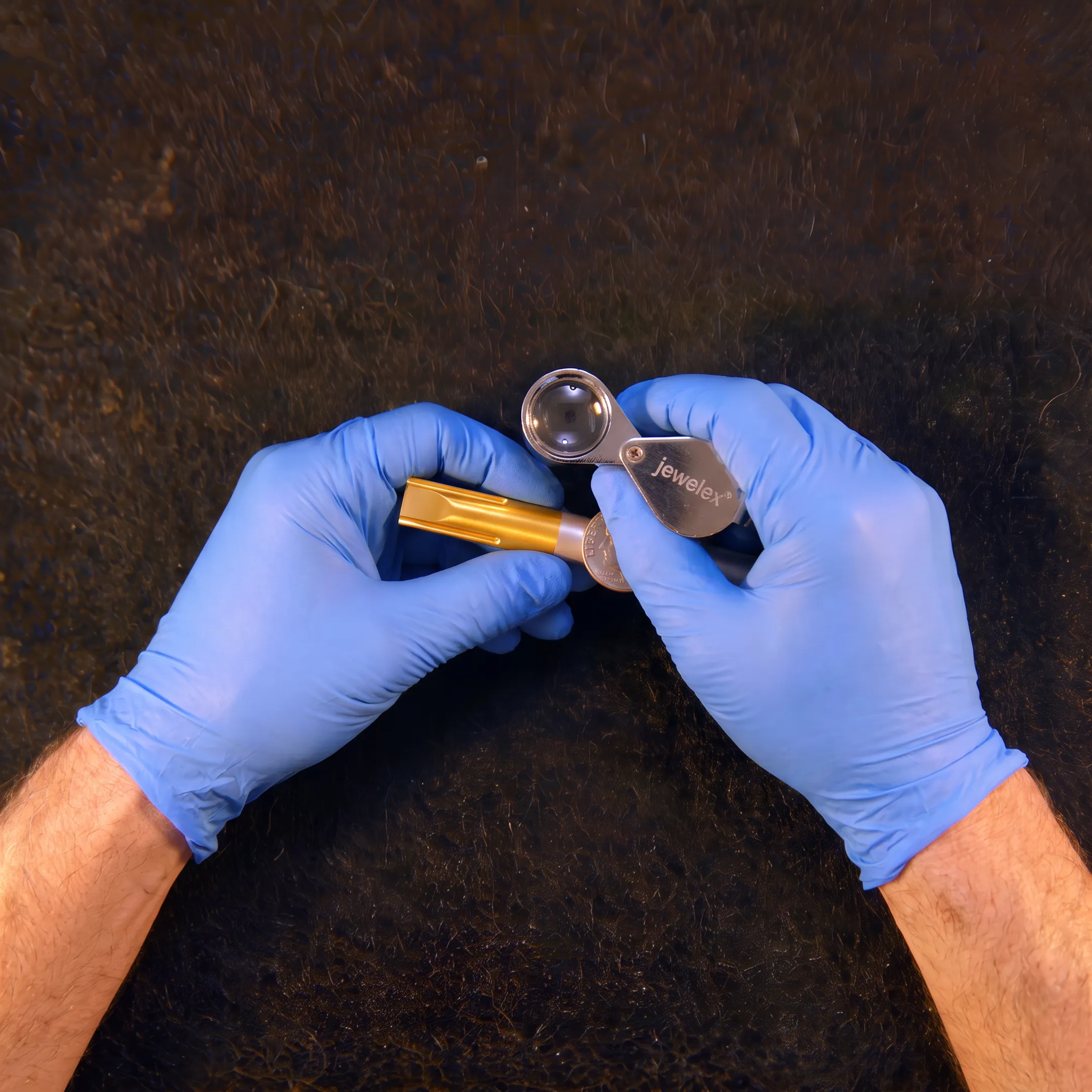 Technician inspecting coated medical components