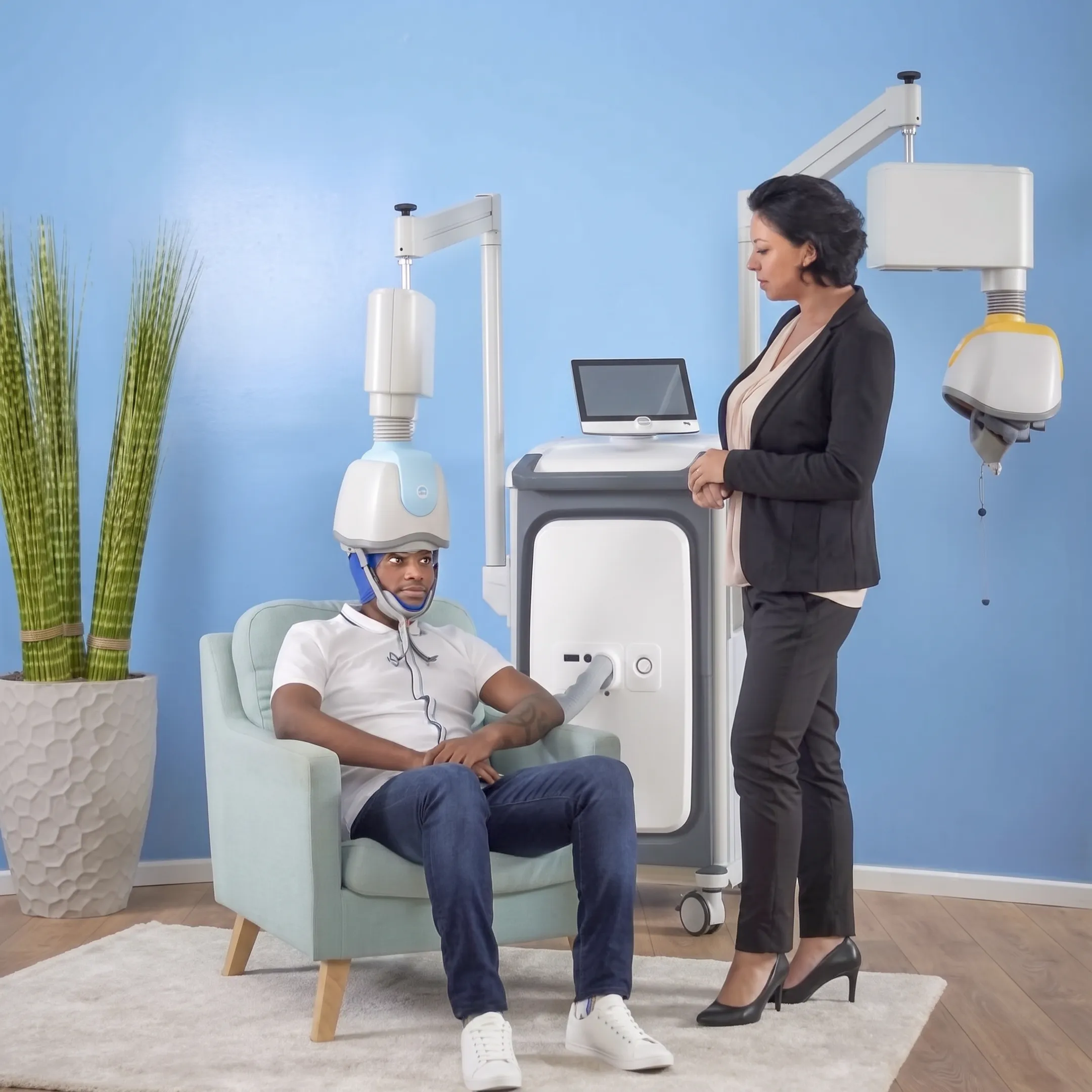 Patient receiving TMS therapy in a comfortable clinic