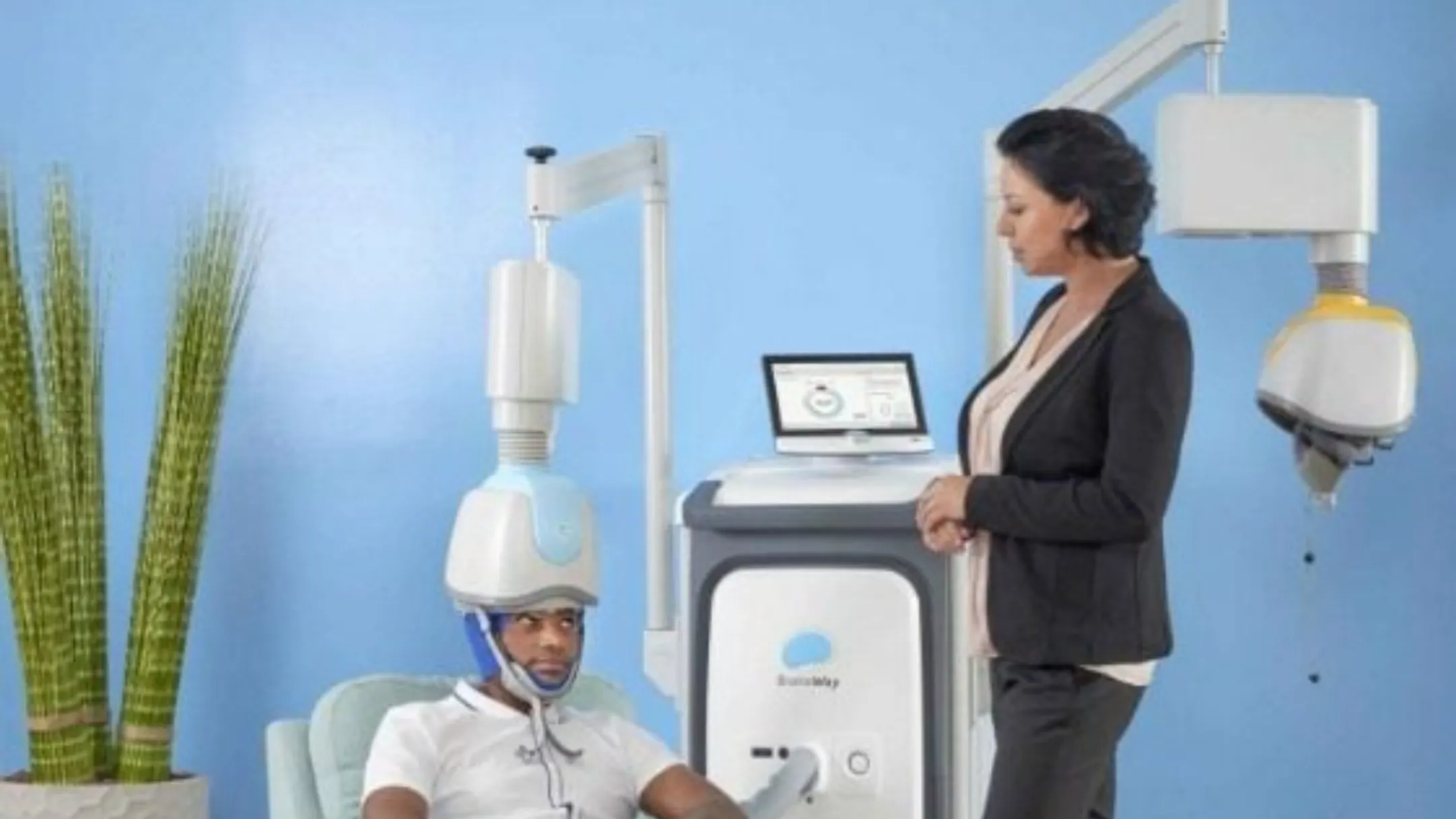 Deep TMS therapy session with patient receiving BrainsWay H7-coil treatment