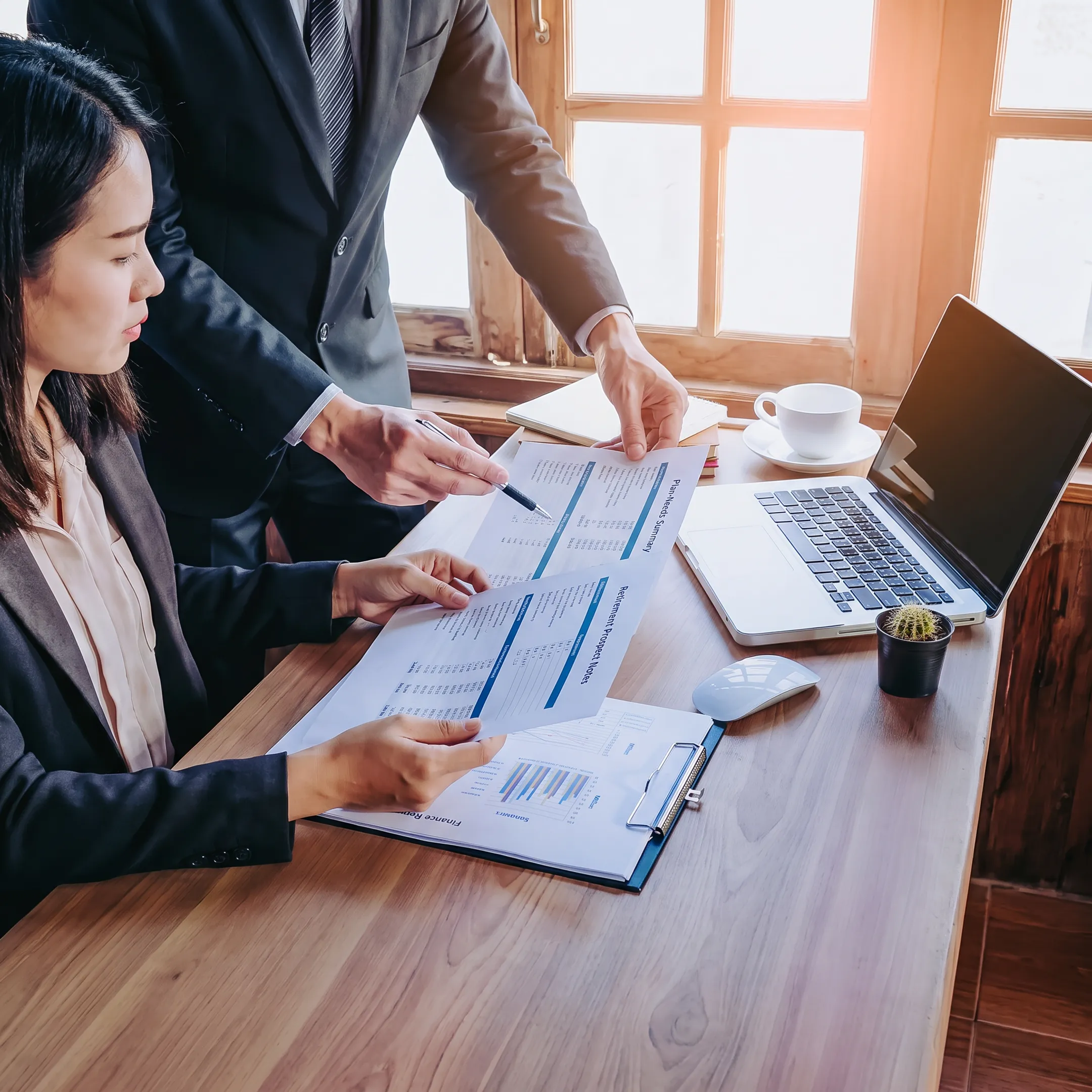 Retirement professional reviewing qualified prospect information with a business decision-maker