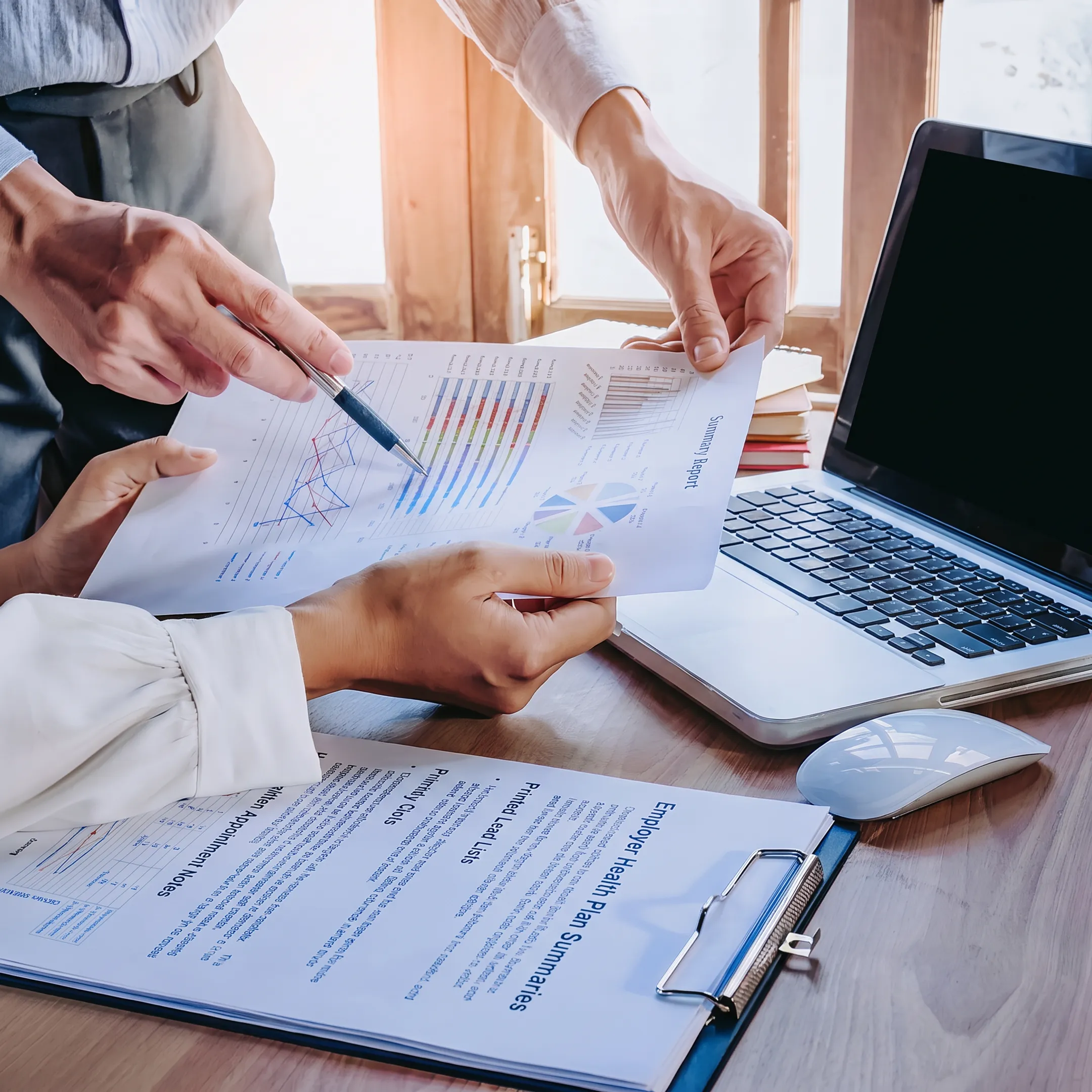 Benefits professionals reviewing qualified medical stop loss leads