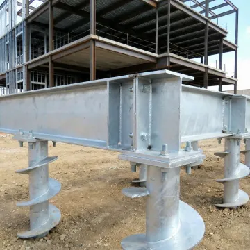 Helical pile foundation system supporting commercial building structure