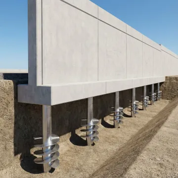 Helical pier foundation system supporting retaining wall structure