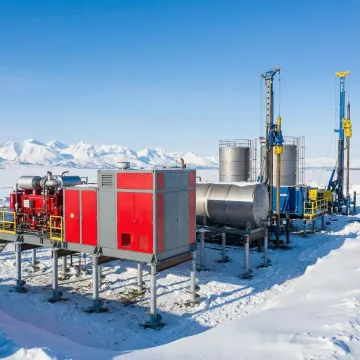 Helical pile foundation system supporting industrial equipment in winter conditions