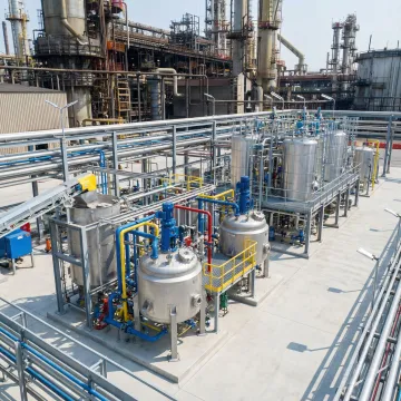 Industrial facility with large equipment mounted on helical pile foundations