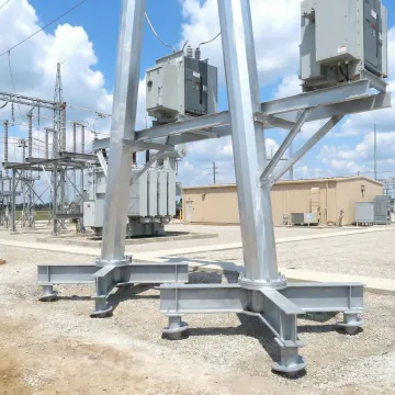 Industrial helical pile foundation system supporting heavy equipment
