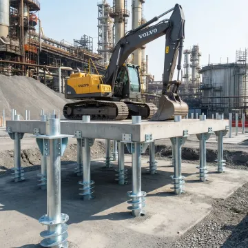 Helical pile foundation system supporting industrial equipment