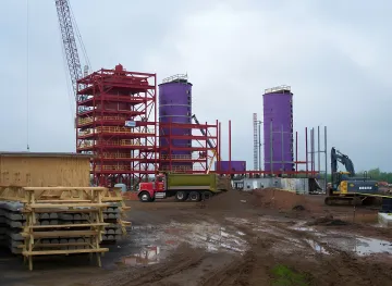 Industrial foundation engineering project with helical pile installation equipment at Florida facility