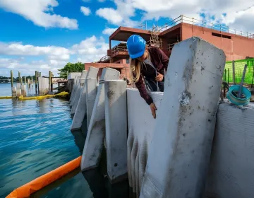 Professional seawall repair crew working on Miami waterfront property