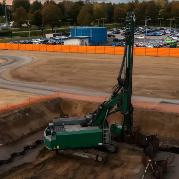 Professional sheet pile retaining wall installation in progress