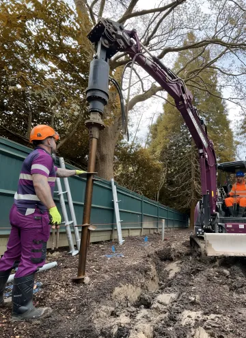 Commercial helical pile installation equipment working on Virginia Beach construction site