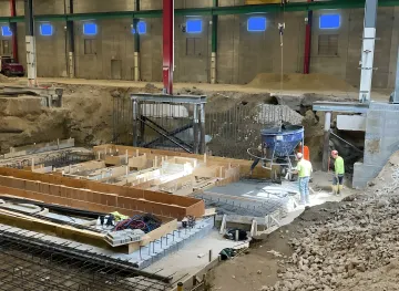 Industrial helical pile foundation installation at North Carolina manufacturing facility