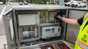 Traffic signal cabinet components including conflict monitors and backup power systems
