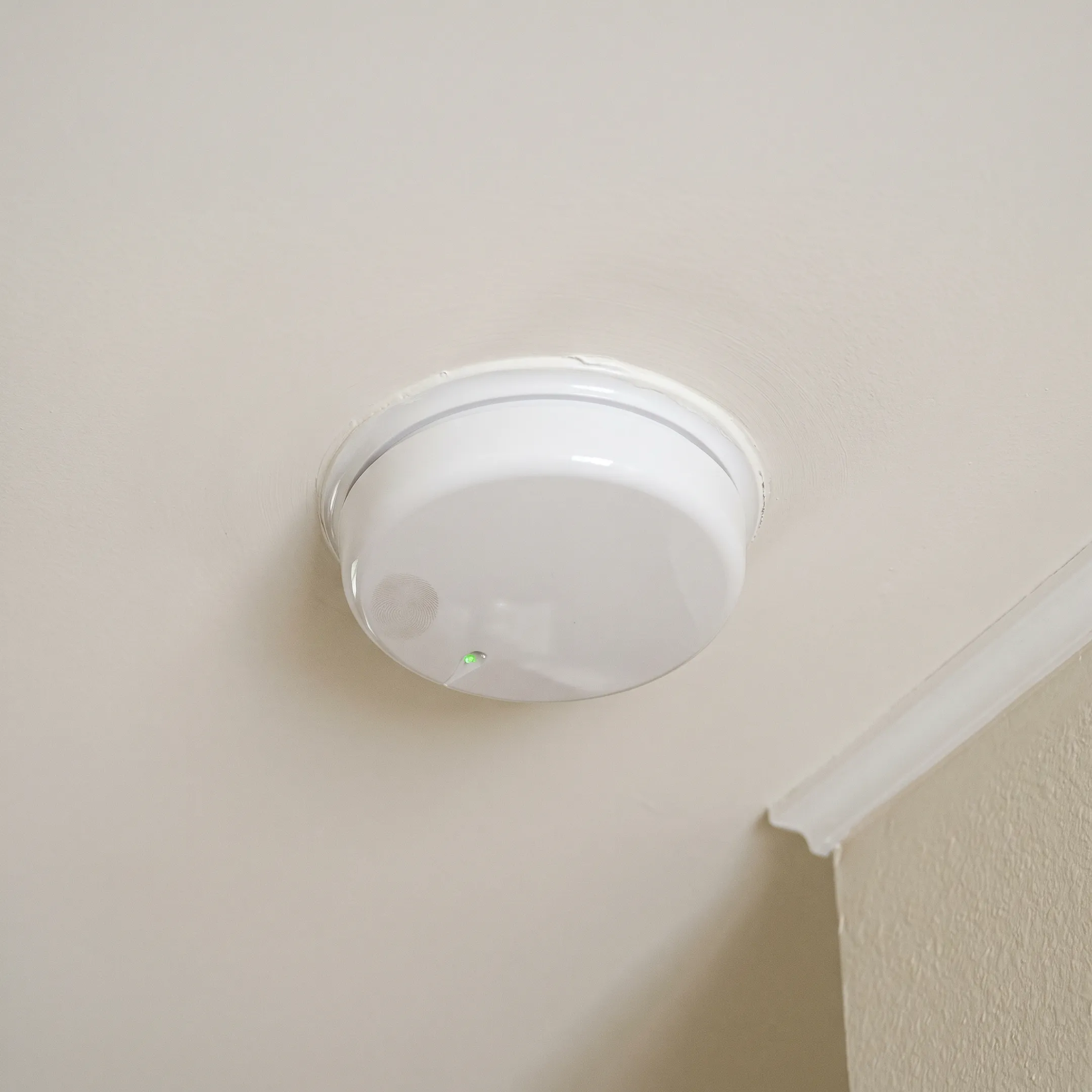 Hardwired smoke detector installed in home