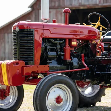 Restored agricultural tractor with durable powder coat finish