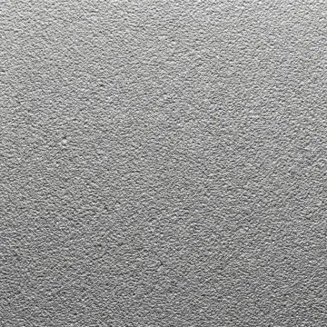 Close-up of professionally sandblasted metal surface showing uniform texture