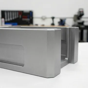 Close-up of smooth satin finish on metal surface after glass bead blasting