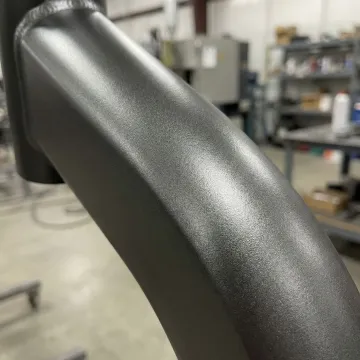 Close-up of heat resistant powder coated metal surface showing durability