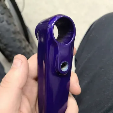 Close-up of professionally powder coated metal surface showing smooth finish