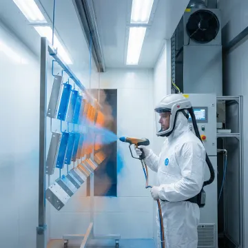 Professional powder coating application on metal components in Pinellas County facility