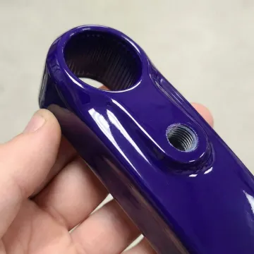 Close-up of smooth epoxy powder coated metal surface showing professional finish quality