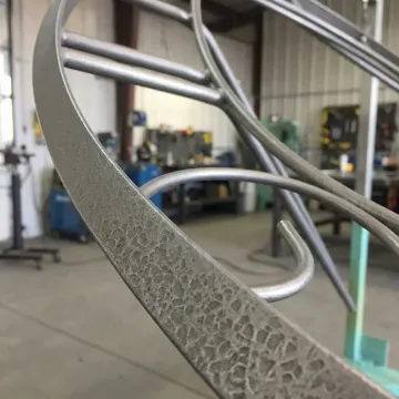 Close-up of professionally blast cleaned industrial metal showing uniform surface profile