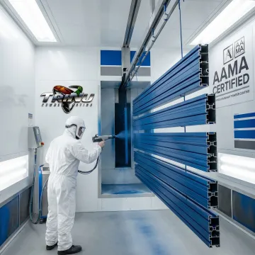 Professional powder coating application on metal components in industrial facility